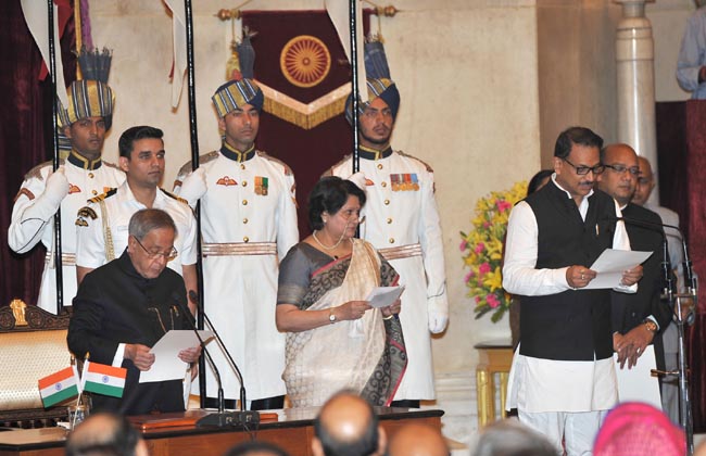President  Pranab Mukherjee administering the oath as Minister of State (Independent Charge) to  Rajiv Pratap Rudy, at a Swearing-in Ceremony, at Rashtrapati Bhavan, in New Delhi on November 09, 2014.